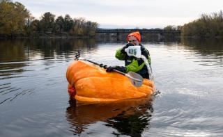Man in pumpkin boat