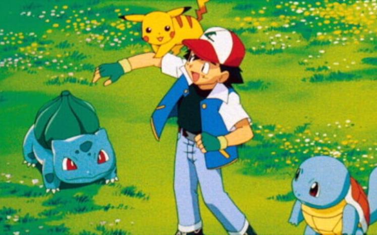 animated pokemon characters including boy and three creatures playing outside on grass